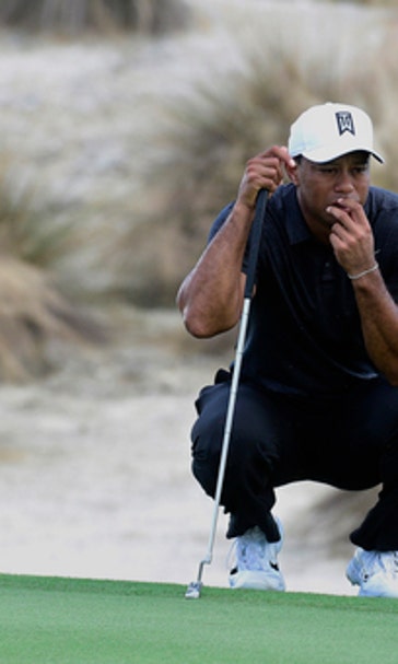 Tiger gets passing grade in 1st round in 10 months